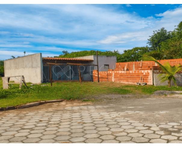 Terreno 189m² com casa inacabada ocupada
