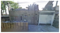 Terreno de 382m² com casa de alvenaria, murado, em Bertioga