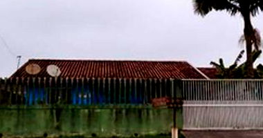 Terreno com residência em alvenaria em Guaratuba/PR