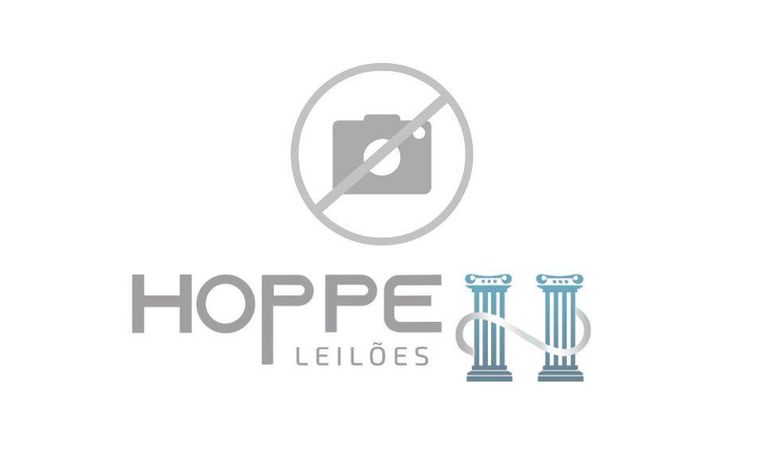 Lote em declive com 400m² e casa simples