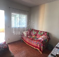 Terreno com construção de 130m², 2 quartos, 1 vaga
