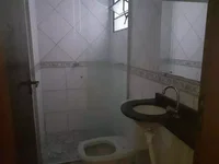 Casa Ocupada com 1 Vaga e Varanda em Praia Grande