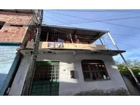 Casa ocupada com 50,13 m² de área construída