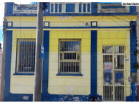Casa térrea com terreno 7,10x60,52m, alvenaria e telhas de barro