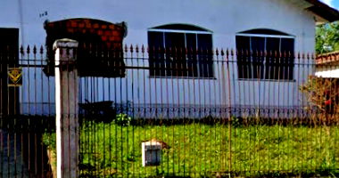 Terreno com casa em alvenaria em Ponta Grossa/PR