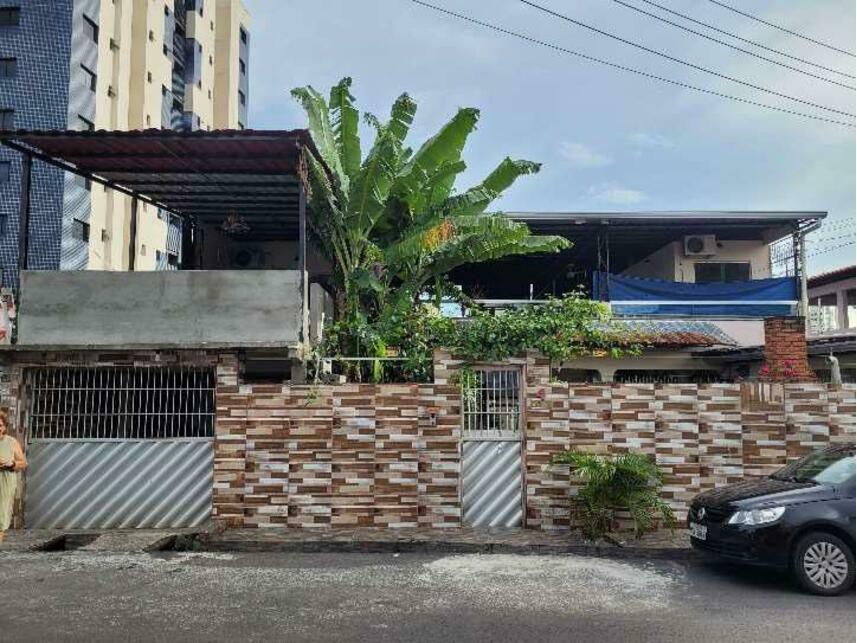 Casa com 410m² construídos, 300m² de terreno, ocupada