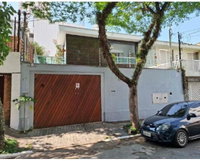 Casa com 4 suítes, edícula e 306m² construída, ocupada