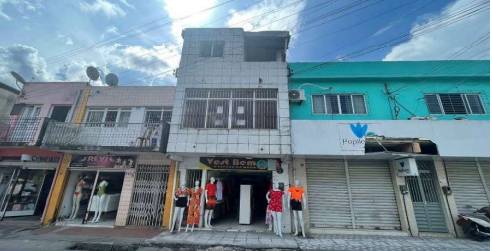 Prédio comercial ocupado com 54m² área construída