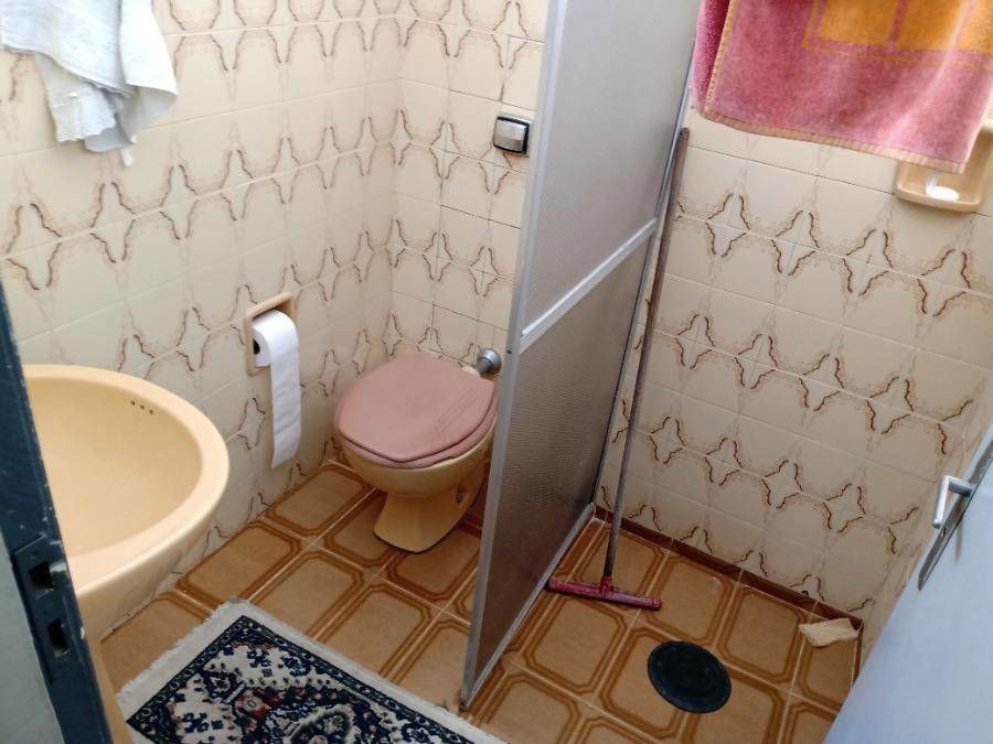 Casa com 3 quartos, 2 banheiros e 98 m² construída, ocupada