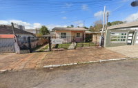 Terreno urbano com casa mista e anexos, 308,10m²