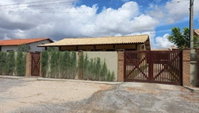 Casa padrão com 4 quartos, 6 banheiros e 1 vaga, área total de 600m²