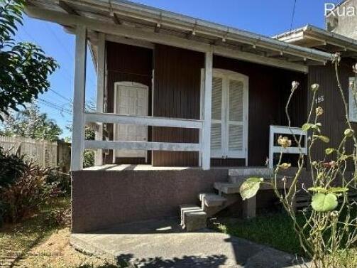 Terreno com casa mista 2 quartos, banheiro e edícula com garagem