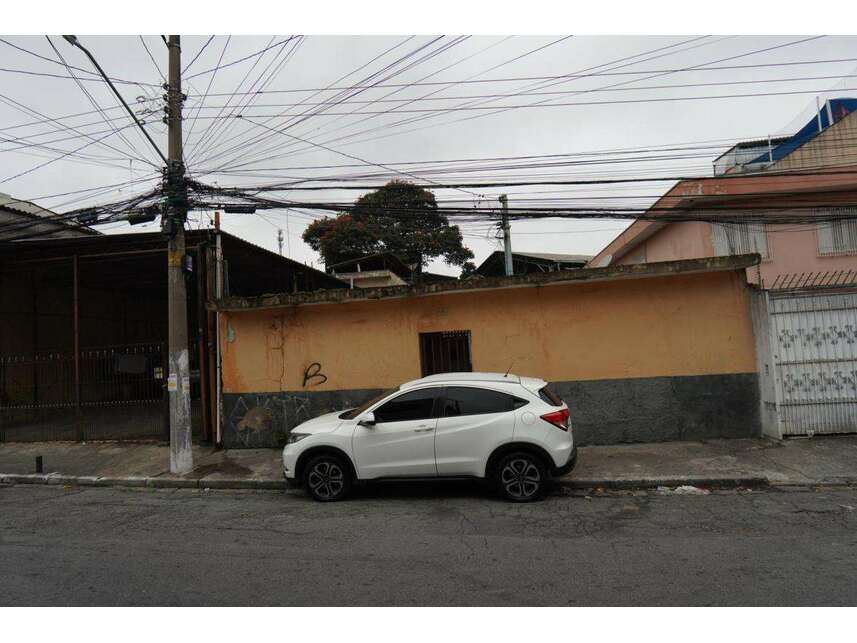 Casa com 3 residências geminadas, 254,50m² de terreno, ocupada