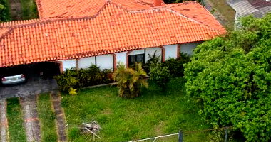Terreno Urbano com Casa em Atlântida