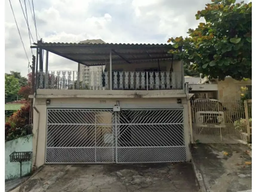 Casa com 3 quartos, 2 banheiros, 2 vagas, 211m² construída, ocupada