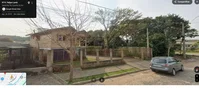 Terreno urbano com casa de madeira e laje, 372m²