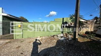 Terreno Urbano com Edificação Residencial e Comercial