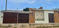 Casa com 3 quartos, 2 banheiros e 150m² construída, ocupada