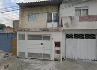 Terreno com área construída em Poá