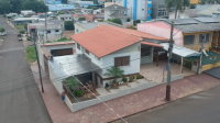 Casa com 3 quartos, 2 banheiros e 126,60m² de área construída, ocupada