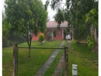 Casa Ocupada com Ampla Área em Parque Serrano