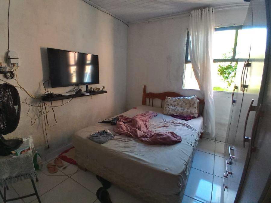 Casa padrão com 168m² construída em terreno de 385m², ocupada