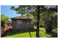Casa e Barracão em madeira com 750m² de terreno em Marialva/PR
