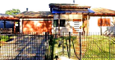 Terreno urbano 960m² com casa de madeira 63m² e subsolo 35m²