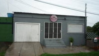 Casa espaçosa com 4 quartos, 3 banheiros e 160m² construída, ocupada